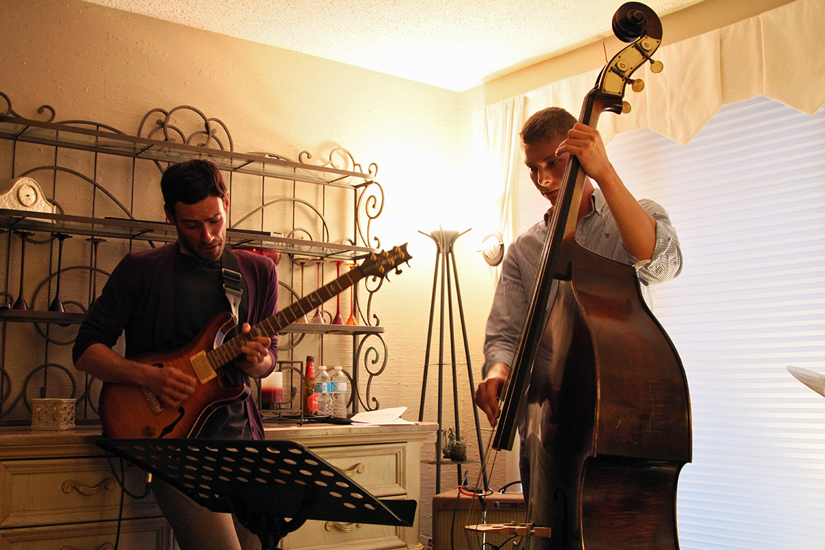 The Soren Nissen, Ian Wright and Nate Renner trio. Nissen and Renner trade licks in the living room. Photo taken Friday, May 17, 2013.